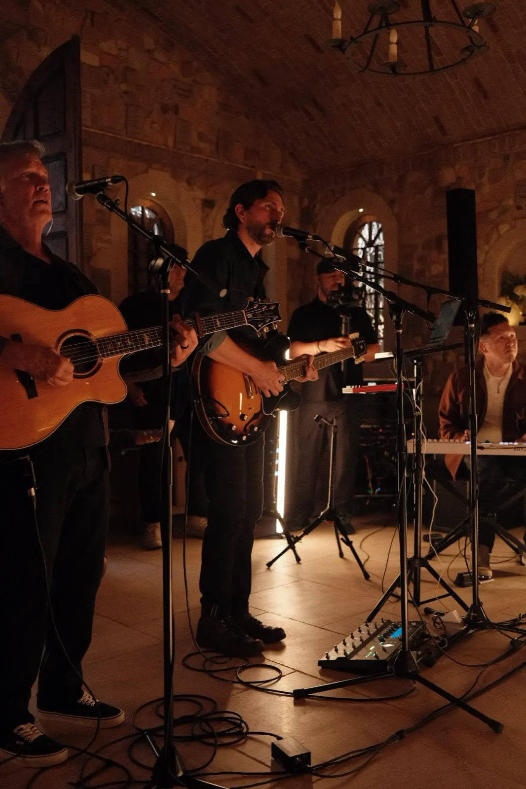 The worship band leading from the front of the chapel during evening worship at The Hidden Encounter