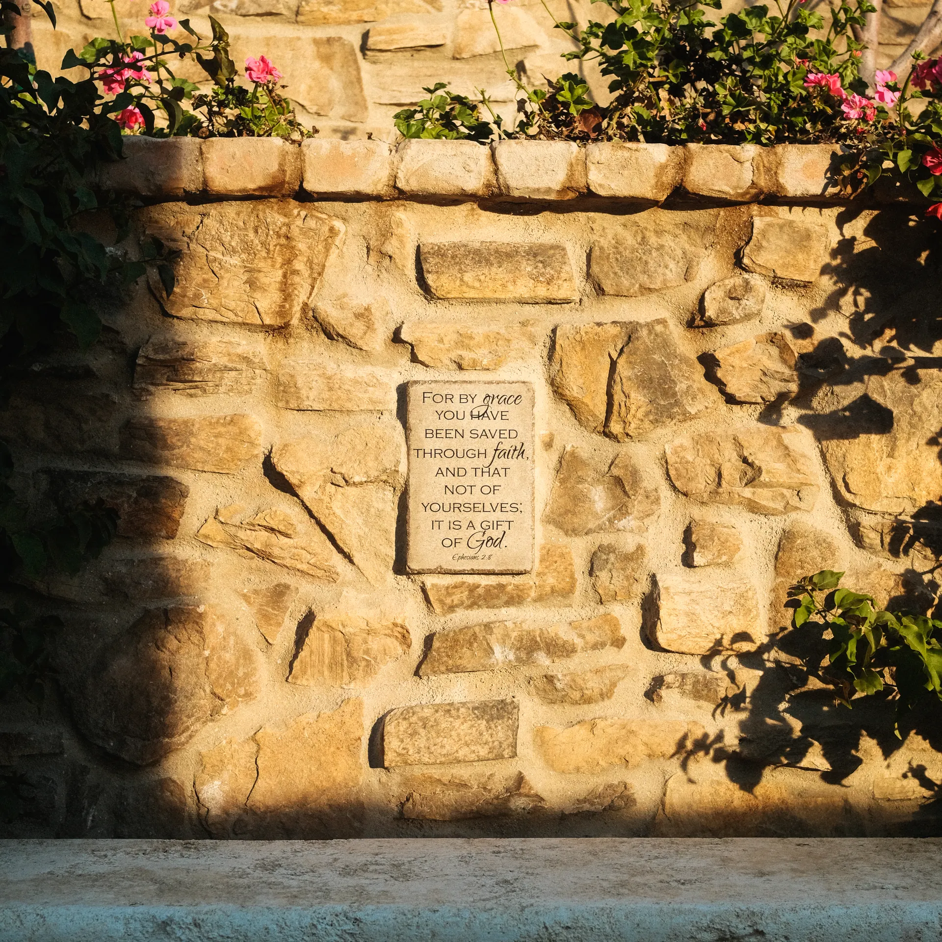 Stones with Scripture inscribed, set into the grounds of The Hidden Encounter