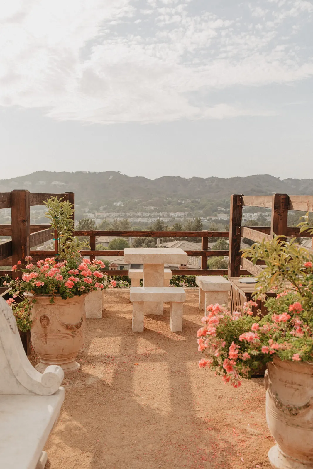 Stone terrace overlooking valley hills at The Hidden Encounter, Coto De Caza