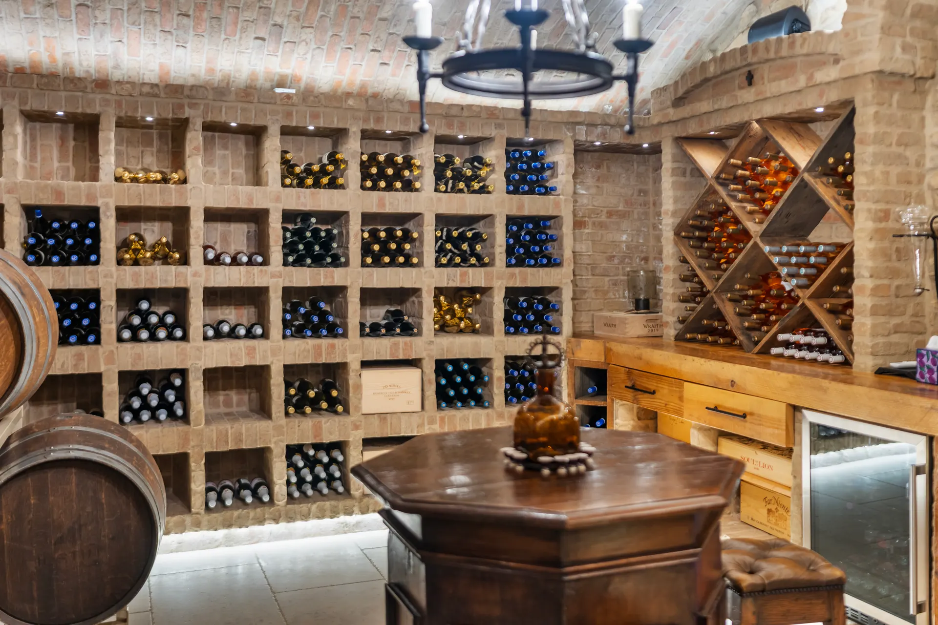 Timber tasting table and stools set between the racked walls