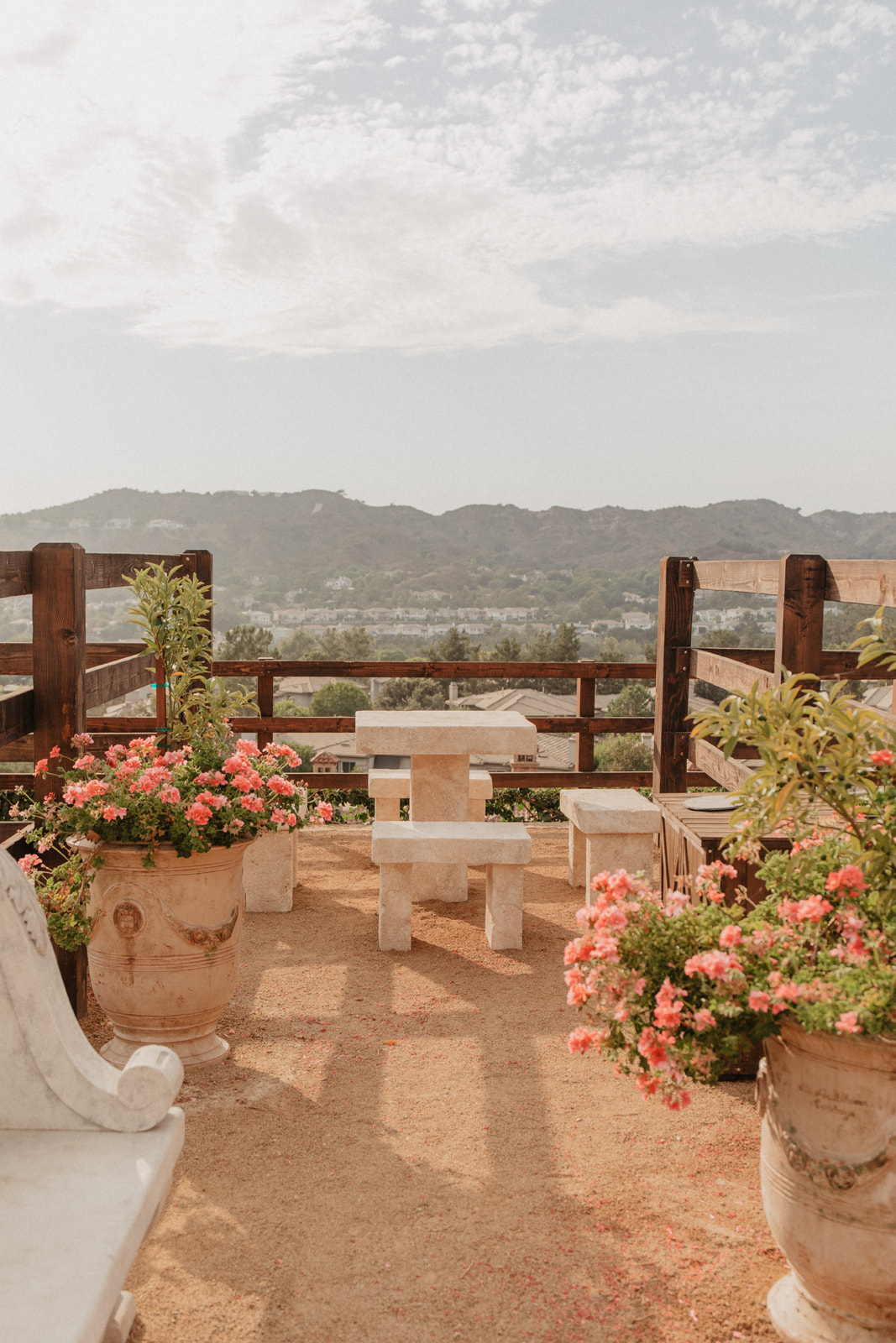 Stone terrace overlooking valley hills at The Hidden Encounter, Coto De Caza
